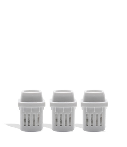 Three white plastic inhaler pieces on a white background

