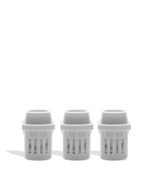 Three white plastic inhaler pieces on a white background
